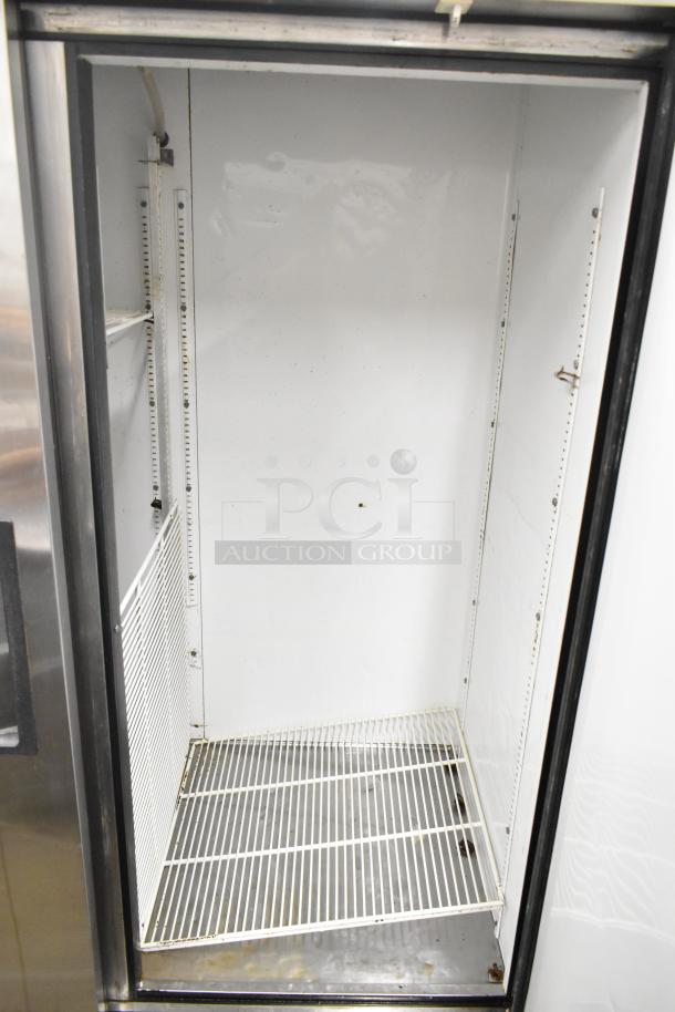 True T-49 commercial 2-door reach-in cooler, 115 volts, 1 phase, white interior, adjustable shelving, clean condition.