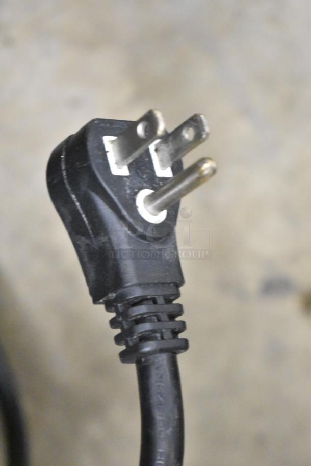 Close-up of a three-prong AC power plug used for Turbo Air TCBE-36SDR-N6 commercial chef base.