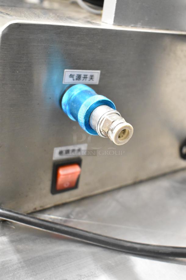 G1WG Countertop Quantitative Filling Machine, stainless steel, blue connector, switch, labels indicating controls.