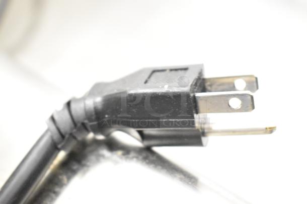 Black power plug for G1WG Countertop Quantitative Filling Machine, showing two-prong configuration, slightly worn condition.