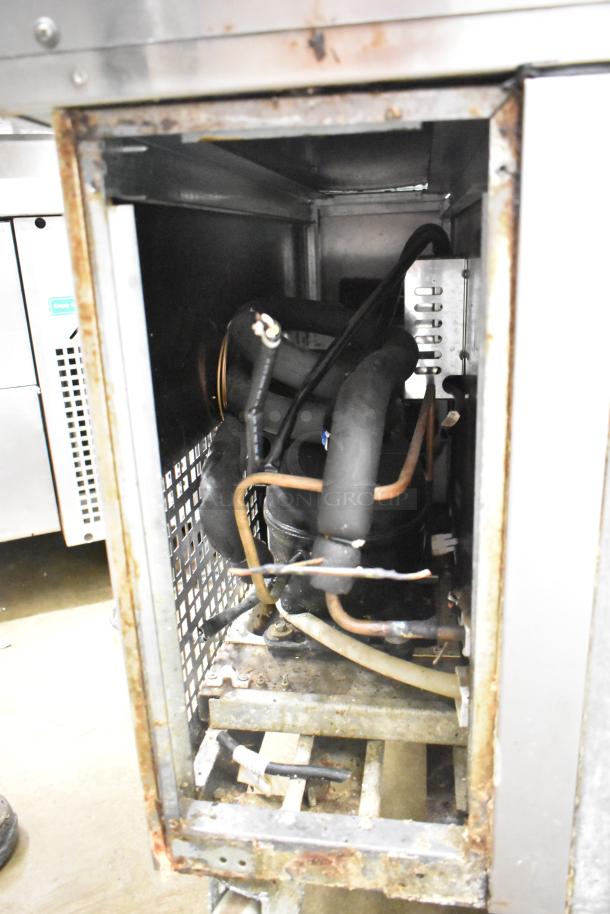 2019 Atosa MGF8453GR commercial chef base, showing internal components and casters, 4 drawers, 115V, 1 phase.