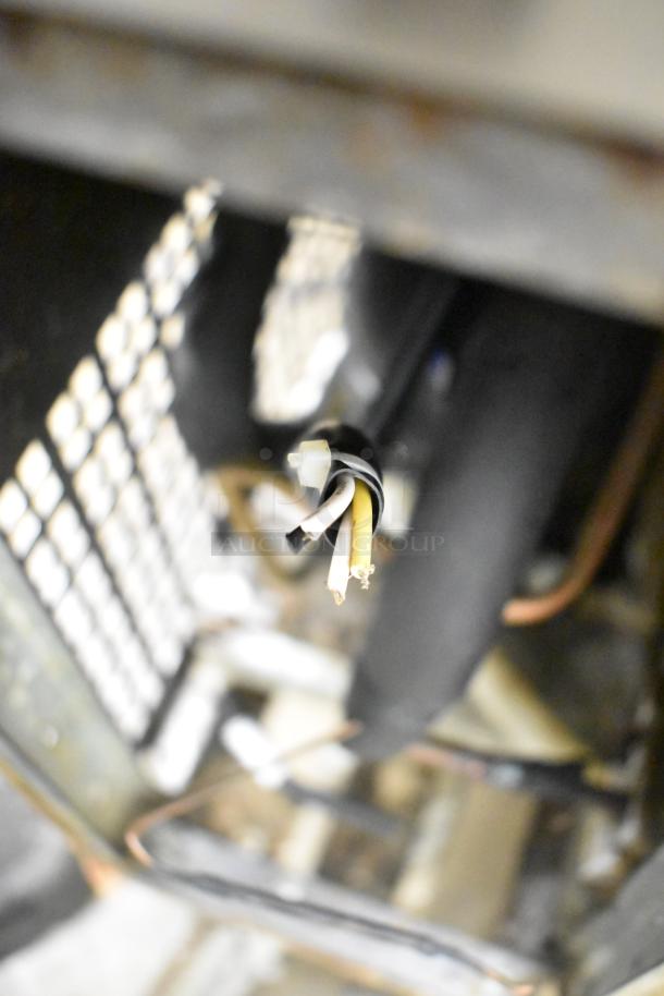 Close-up of the wiring for a 2019 Atosa MGF8453GR Commercial Chef Base, indicating a need for repair or rewiring.