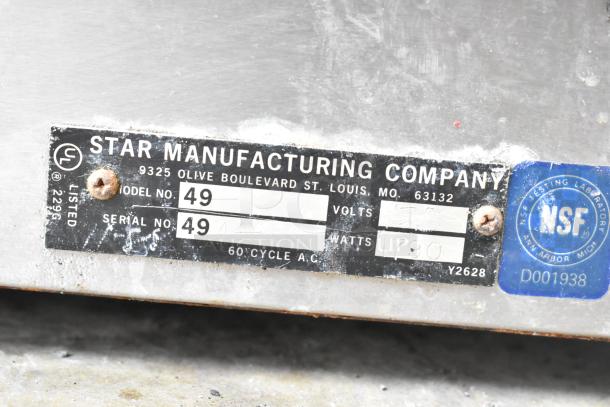 Star 49 countertop popcorn machine, 115 volts, 1 phase. Visible label with model, serial number, and NSF certification.