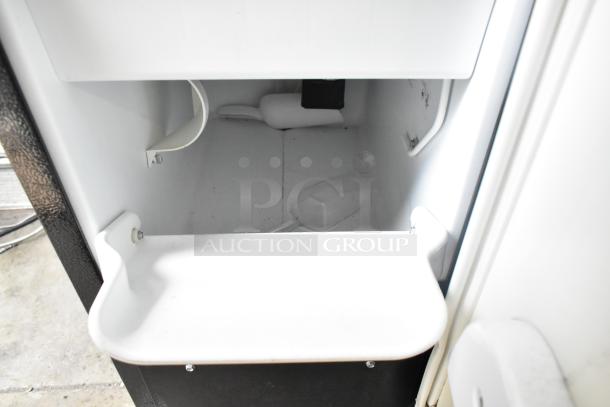 General Electric GE ZDIS150WSS E ice maker, 15-inch built-in, with 25 lbs storage and 50 lbs daily production capacity.