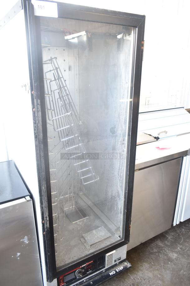 Metro HM2000 Heated Holding Cabinet, commercial casters, 115V, 1 Phase, worn condition. Visible shelving and control panel.