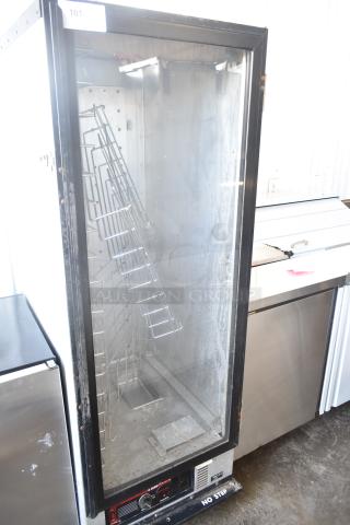 Metro HM2000 Heated Holding Cabinet, commercial casters, 115V, 1 Phase, worn condition. Visible shelving and control panel.