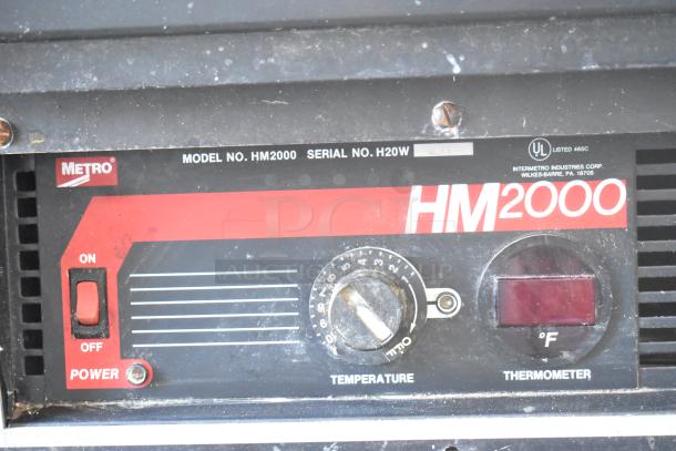 Metro HM2000 Commercial Heated Holding Cabinet, control panel view. Features temperature dial and thermometer. 115V, 1 phase.