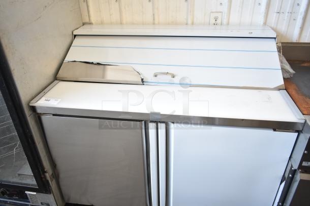 Brand new Kutano KUT24DPT prep table, minor dents visible, commercial casters, 115V, Bain Marie mega top.