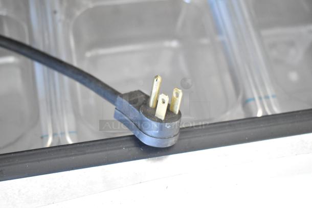 Three-prong plug detail of Kutano KUT24DPT Sandwich Salad Prep Table, commercial grade, 115V, 1 Phase.