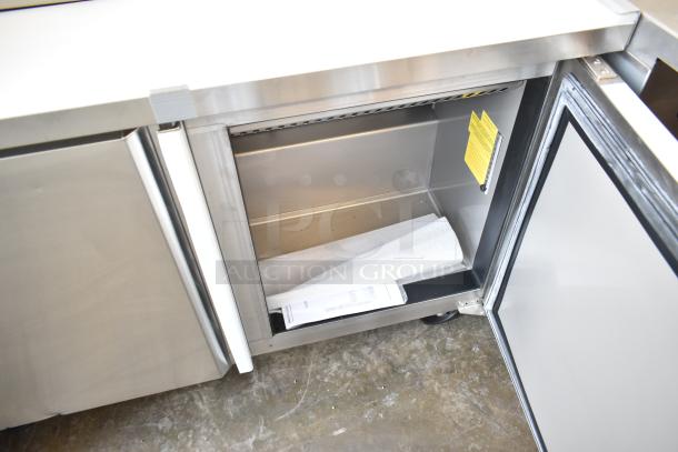 Brand new Kutano KUT24DPT commercial prep table, stainless steel, 115V, 1-phase, minor scratches, label visible inside.