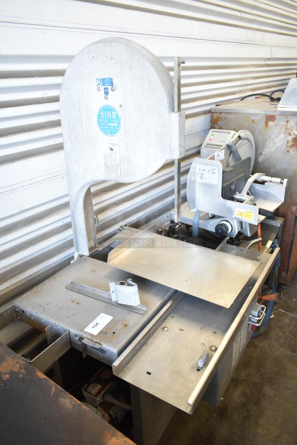 Biro 3334 commercial floor-style meat saw in good condition. Features metal construction and visible brand label.