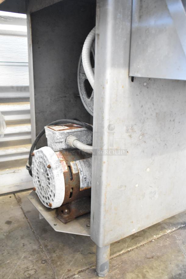 Biro 3334 Commercial Floor Meat Saw, showing motor and lower components, used condition with visible wear and rust.