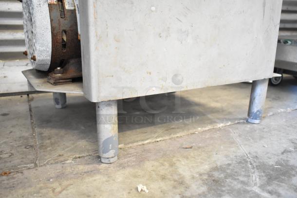 Biro 3334 commercial meat saw with visible wear, solid metal construction, and sturdy legs. Ideal for heavy-duty use.