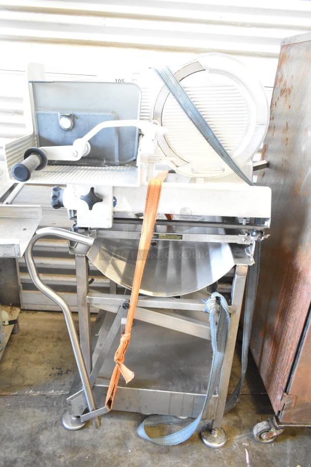 Bizerba VS 12 F commercial manual vertical slicer on meat slicer equipment stand, sturdy metal frame.