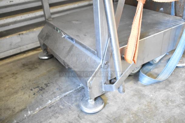 Bizerba VS 12 F manual vertical slicer on equipment stand, stainless steel base, equipped with wheels, minor wear visible.