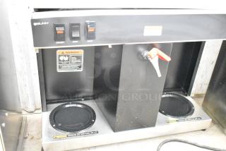 Bunn commercial countertop 2 burner coffee machine with hot water dispenser, 120 volts, 1 phase, warning labels visible.