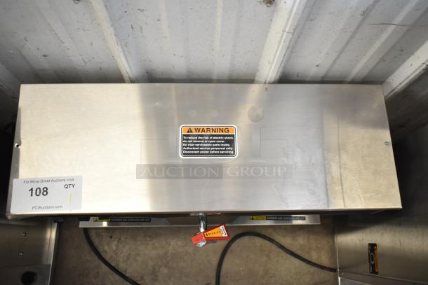 Bunn commercial countertop coffee machine, 2 burners, hot water dispenser, 120 volts, warning label visible.