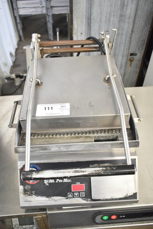 Star Pro Max Commercial Panini Press, countertop model, 115 volts, 1 phase. Visible wear, stainless steel exterior.