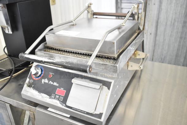 Star Pro Max commercial countertop panini press, 115 volts, 1 phase, with control dials and sturdy handles, in used condition.