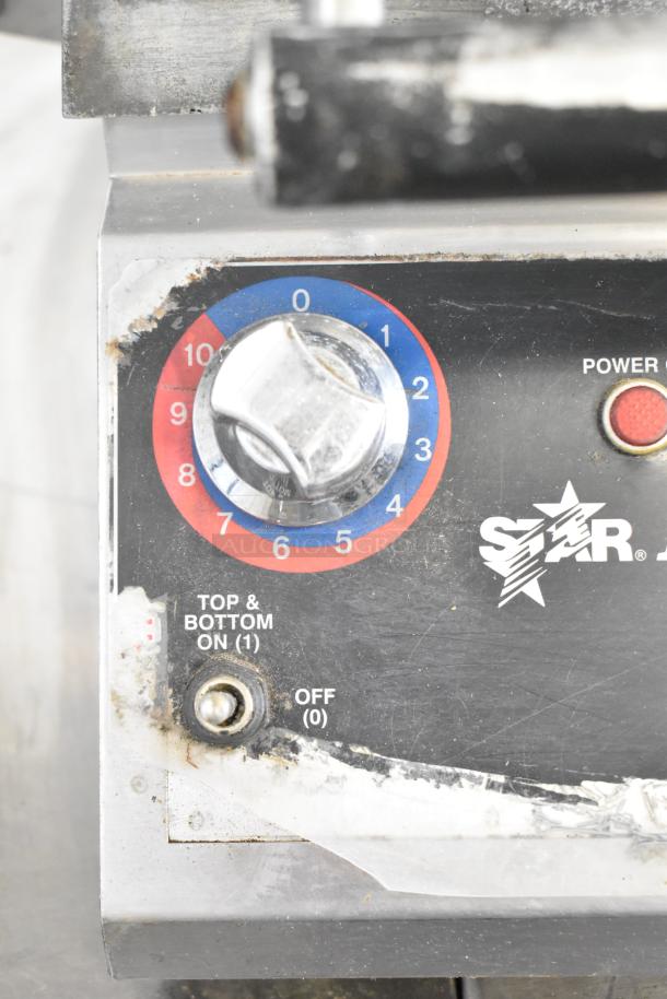 Star Pro Max Commercial Panini Press with dial settings; used condition. 115V, 1 Phase. "Top & Bottom On" label visible.