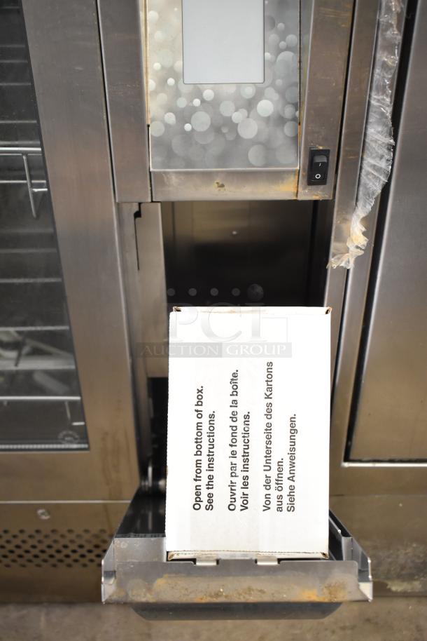 SciCan Hydrim L110W Automated Washer with glass door, stainless steel finish, good condition, instruction box visible.