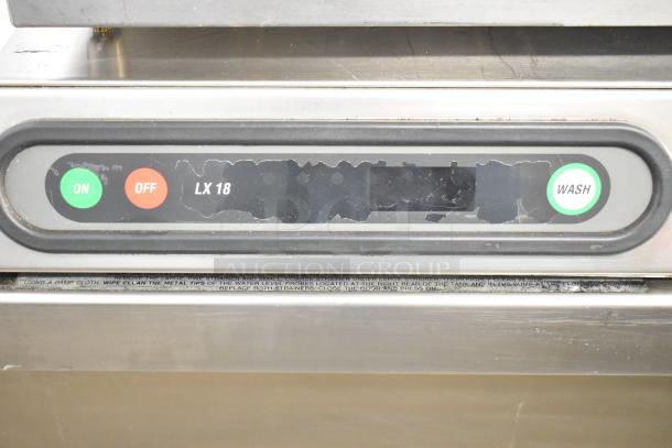 Hobart LX18H commercial undercounter dishwasher control panel, showing on/off buttons and wash indicator.