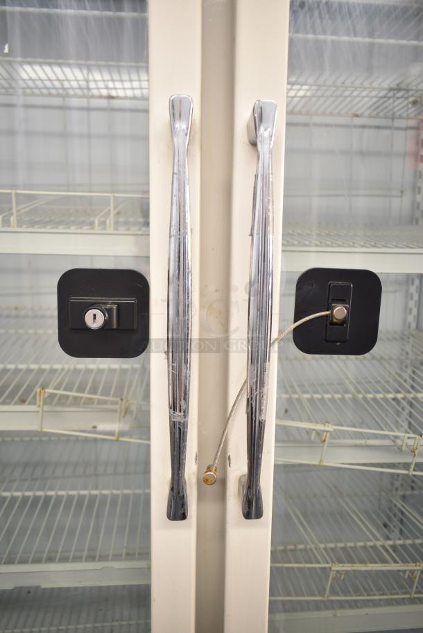 Carrier ULG50BCP-5 commercial 2-door reach-in freezer with locks and wire shelves, clean condition, 115/208-230V, 1 phase.