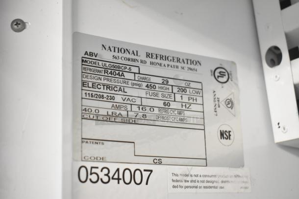 Carrier ULG50BCP-5 commercial freezer tag detailing electrical specs: 115/208-230V, 1 phase, model info, and safety certifications.
