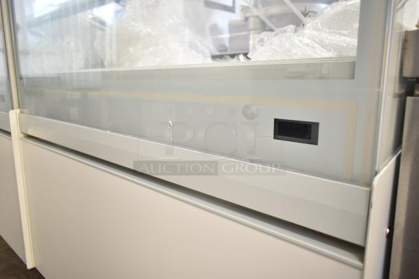 Commercial gelato display case, floor style, featuring tempered glass panels. Excellent condition with minimal wear.