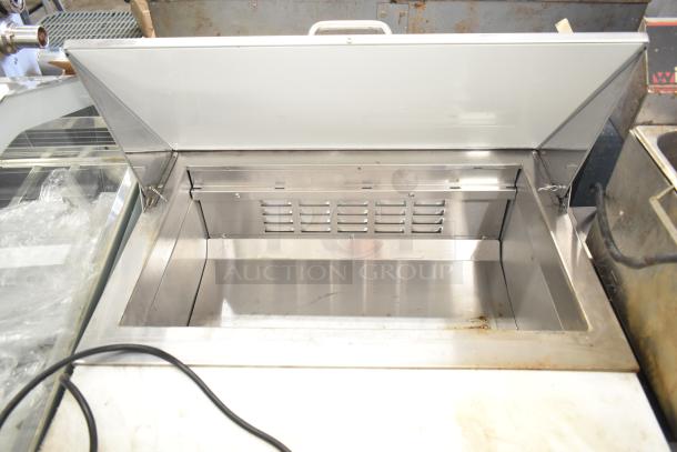 2024 Avantco 178APT27HC prep table with open top, stainless steel interior, commercial casters, and 115V power.