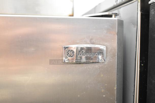 General Electric GE Monogram undercounter cooler, stainless steel, 115V, 1 phase, visible logo plaque, minor wear.
