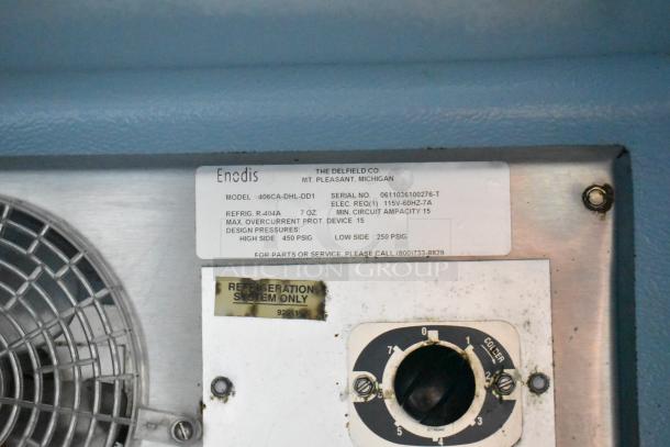 Delfield 406CA-DHL-DD1 cooler label with model, serial number, voltage, and refrigerant details visible.