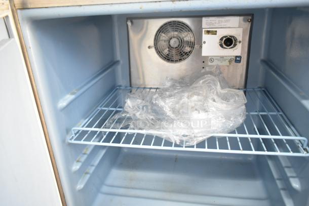 Delfield 406CA-DHL-DD1 commercial undercounter cooler interior, showing wire shelf and control panel. 115 volts, 1 phase.