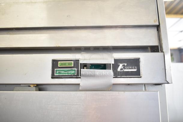 Beverage Air ER48-1AS cooler, 2-door, stainless steel, 115V, E Series label, visible wear.