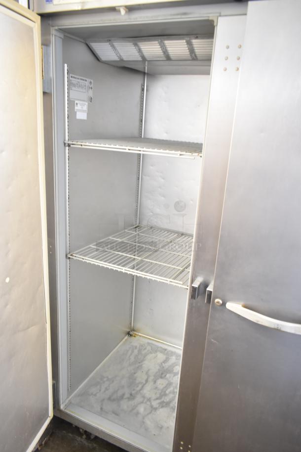 Beverage Air ER48-1AS commercial cooler, 2-door, 115 volts, 1 phase. Features three wire shelves, visible internal wear.