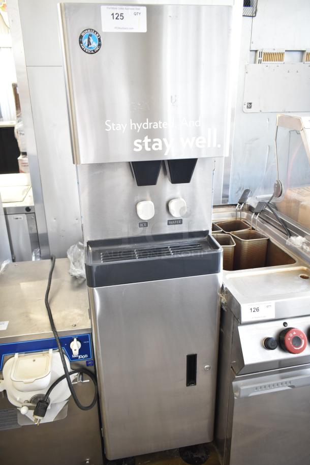 Hoshizaki commercial water and ice dispenser in stainless steel, dual spouts, labeled ice and water, good condition.