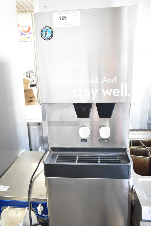 Hoshizaki commercial water and ice dispenser, stainless steel, dual nozzles, model branding visible, auction tag says 125.