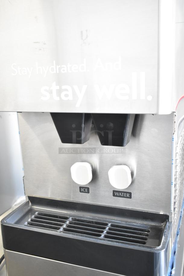 Hoshizaki commercial water and ice dispenser, stainless steel, dual spouts, labeled "Ice" and "Water," clean, used condition.