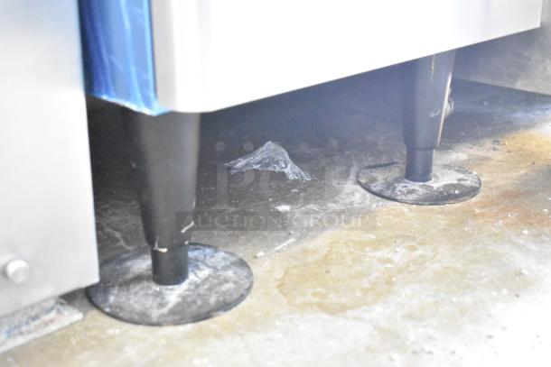 Hoshizaki commercial water and ice dispenser legs shown, highlighting sturdy metal supports and secure installation base.