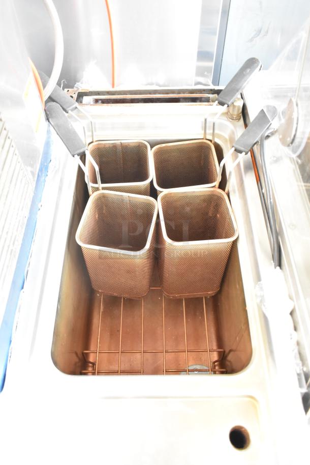 Axis AX-GPC1WB commercial gas pasta cooker with four wire baskets, used condition, stainless steel body.