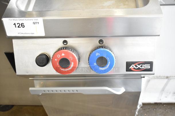 Axis AX-GPC1WB gas-powered pasta cooker, stainless steel, dual control knobs, commercial floor style, auction tag visible.