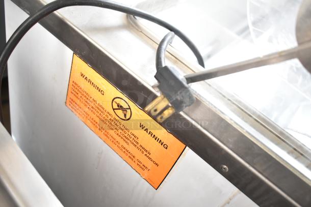 Commercial ice cream dipping cabinet with visible power plug and warning label, emphasizing no drilling.