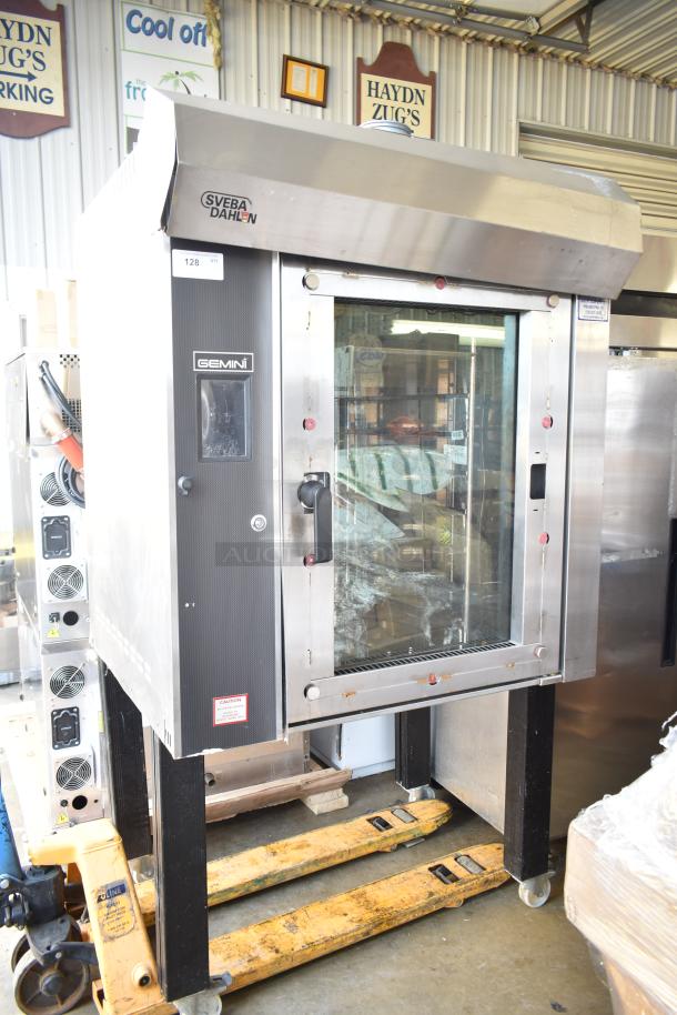 Sveba Dahlen Gemini commercial mini rotating rack oven on casters, stainless steel, visible brand logo, gently used condition.