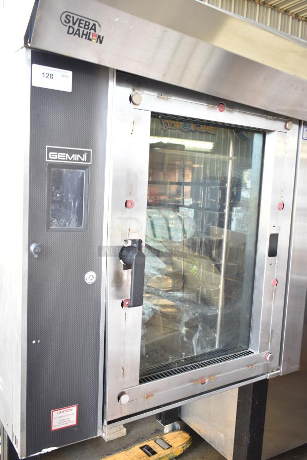 Sveba Dahlen Gemini mini rotating rack oven on casters. Stainless steel, commercial use. Model and safety labels visible.