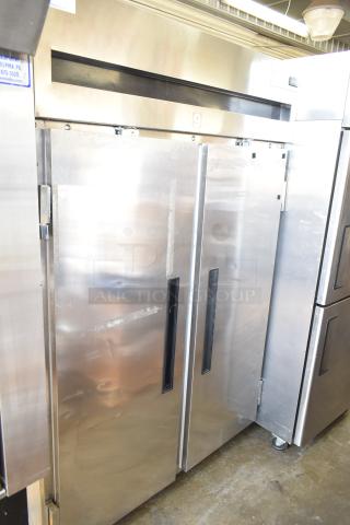 Delfield 6151XL-S commercial 2-door reach-in freezer on casters, stainless steel, 115V, 1 phase, visible wear on doors.