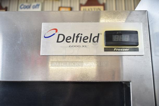 Delfield 6151XL-S Commercial 2 Door Freezer, stainless steel, digital display, 115V, on casters, model label visible.