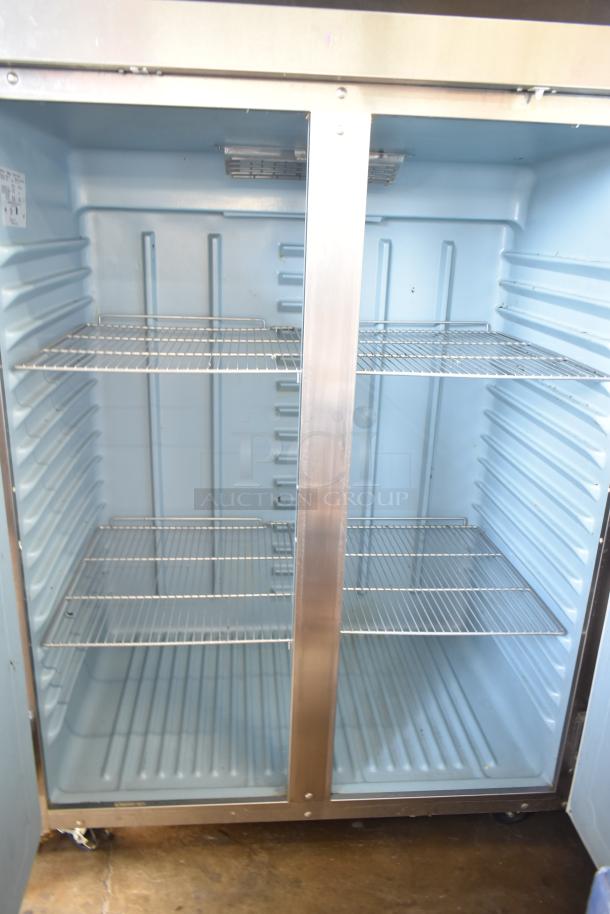 Delfield 6151XL-S Commercial 2 Door Reach In Freezer, stainless steel, on casters, 115 volts, 1 phase, interior shelving.