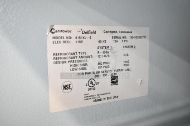 Delfield 6151XL-S commercial 2-door reach-in freezer tag. Details: 115V, 1 phase, R-404A refrigerant, NSF certified. Made in USA.