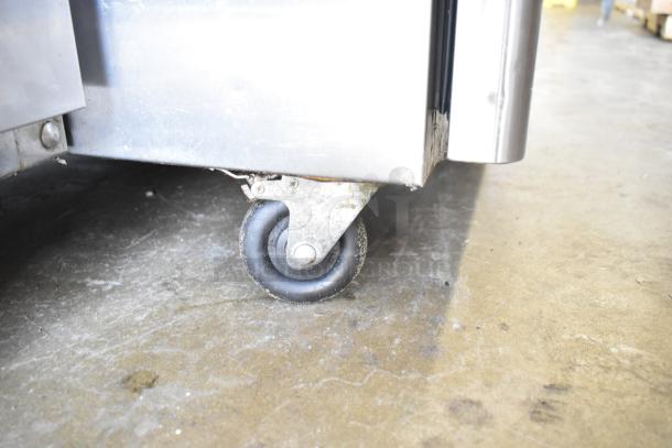 Atosa Commercial 2 Half Size Reach In Cooler, model with sturdy casters, in used condition. 115V, 1 Phase.