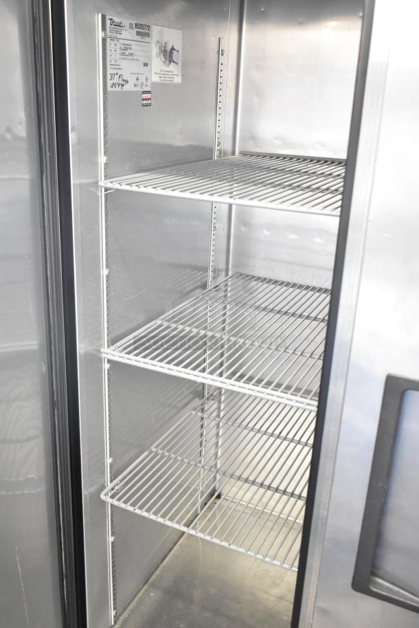 True T-35 Commercial 2 Door Cooler, stainless steel interior, adjustable shelves, model and voltage tags visible.